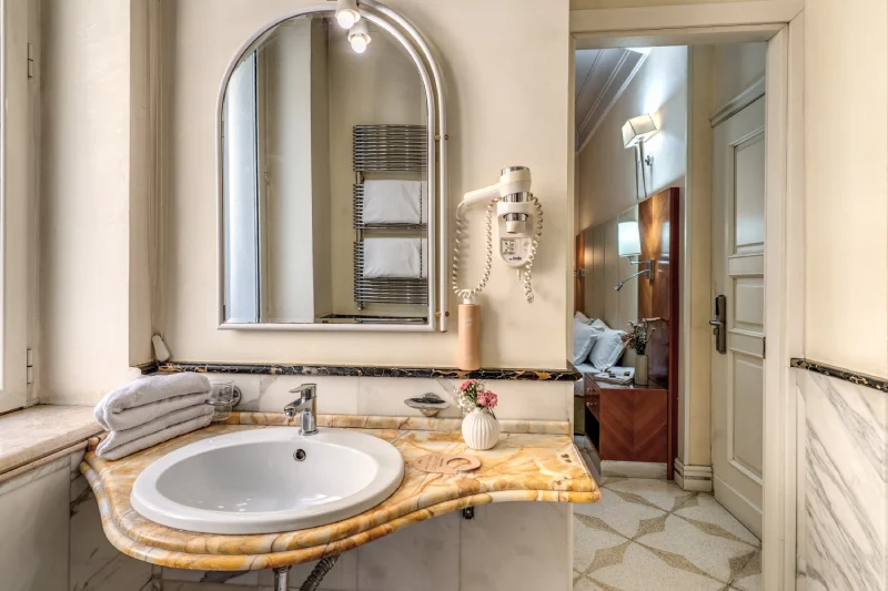 Bathroom with marble sink, large mirror and towels near Rome Opera House - Depandance Opera, BZAR hotels in Rome