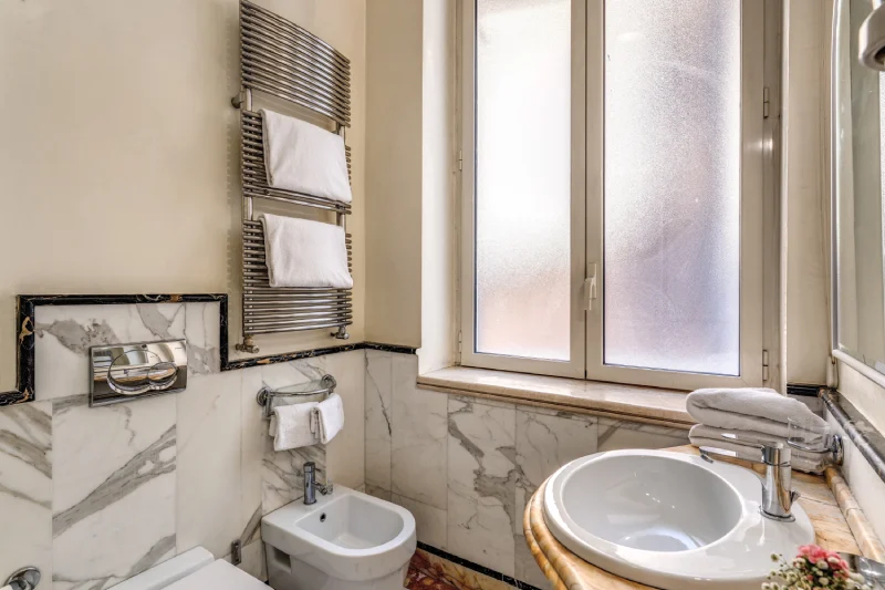 Bright bathroom with window, bidet and marble details near Rome Opera House - Depandance Opera, BZAR hotels in Rome