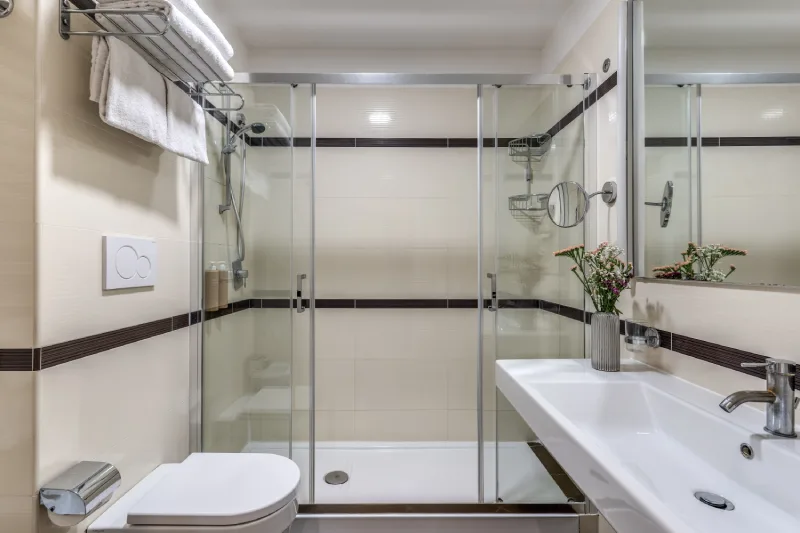 Bathroom with glass shower and sleek sink, towels and modern finishes in Rome centre near Teatro dell’Opera - Hotel Sonya, BZAR hotels in Rome